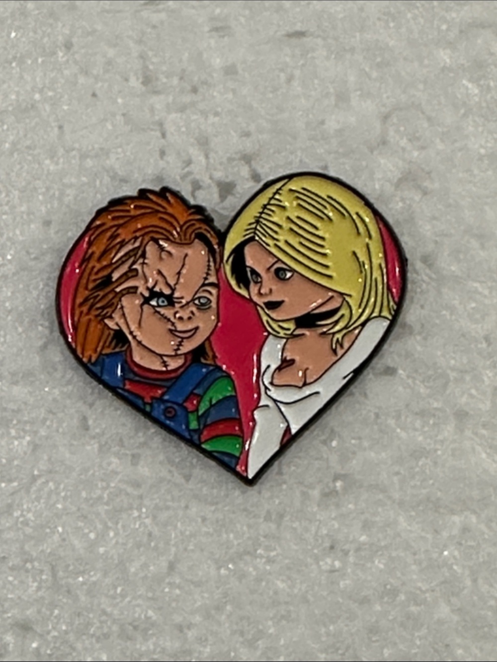 Child’s Play Chucky and Tiffany Heart-Shaped Enamel Pin in Red, Blonde, Brown
